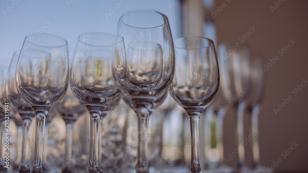 Crystal clear empty wine glasses on the table. Alcohol background. 