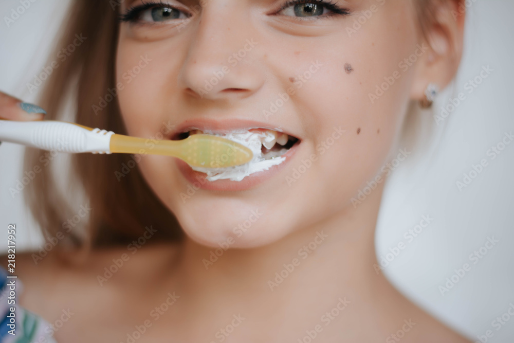 Woman smile. Teeth whitening. Dental care. Happy young woman brushing teeth. Woman smile. Teeth whitening. Dental care. Happy young woman brushing teeth.