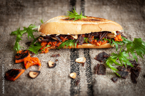 Roll with dried beef and rocket salad