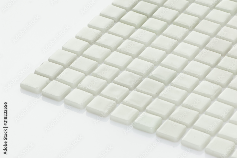 little white ceramic tile on a light background, majolica. for the catalog
