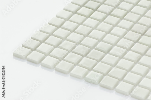 little white ceramic tile on a light background  majolica. for the catalog