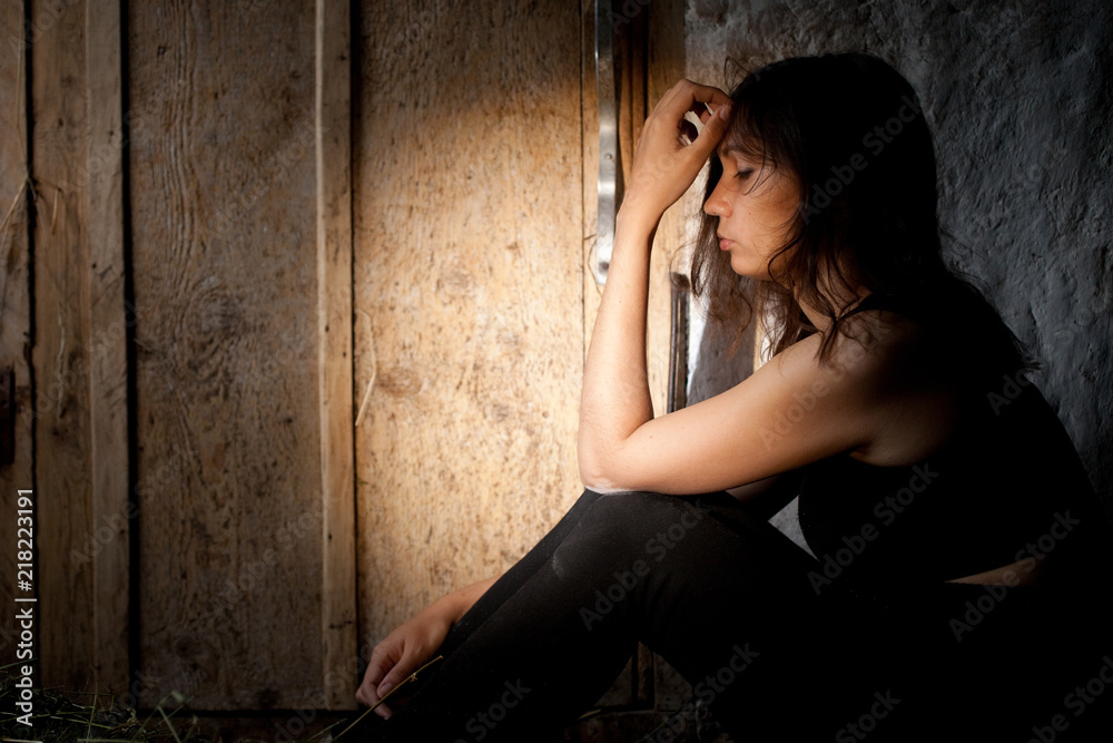 Fototapeta premium Teenager girl with depression alone in the dark room.