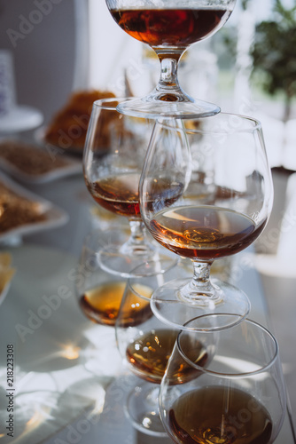 Party and holiday celebration concept. glasses with cognac on the bar counter. 