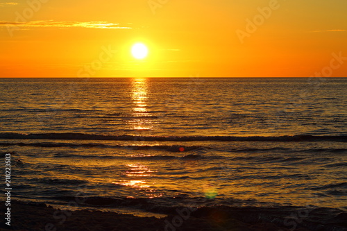 sunset at the baltic sea beach of ustronie morskie, poland © waldenstroem