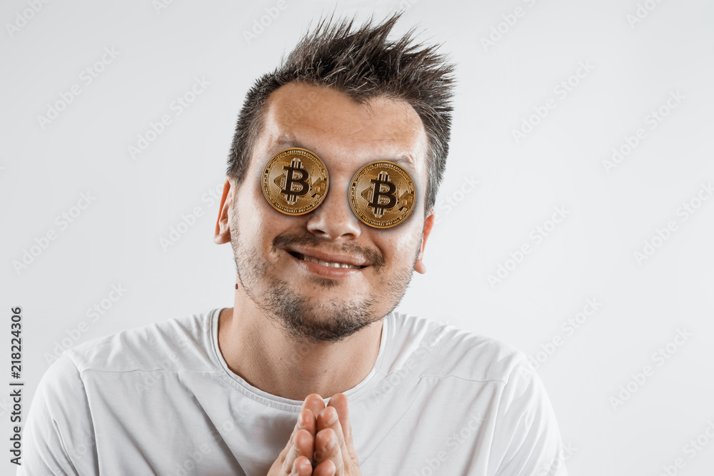 Crazy lover of bitcoins with a golden coin instead of eyes. The concept of bitcoin fever, the popularity of crypto currencies, the desire to earn on mining, the mining of crypto currencies.