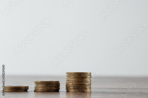 Deposit, coins on the table are laid out in stairs. The concept of bank and investment deposit, interest, money growth, bank deposit. Credit for business.