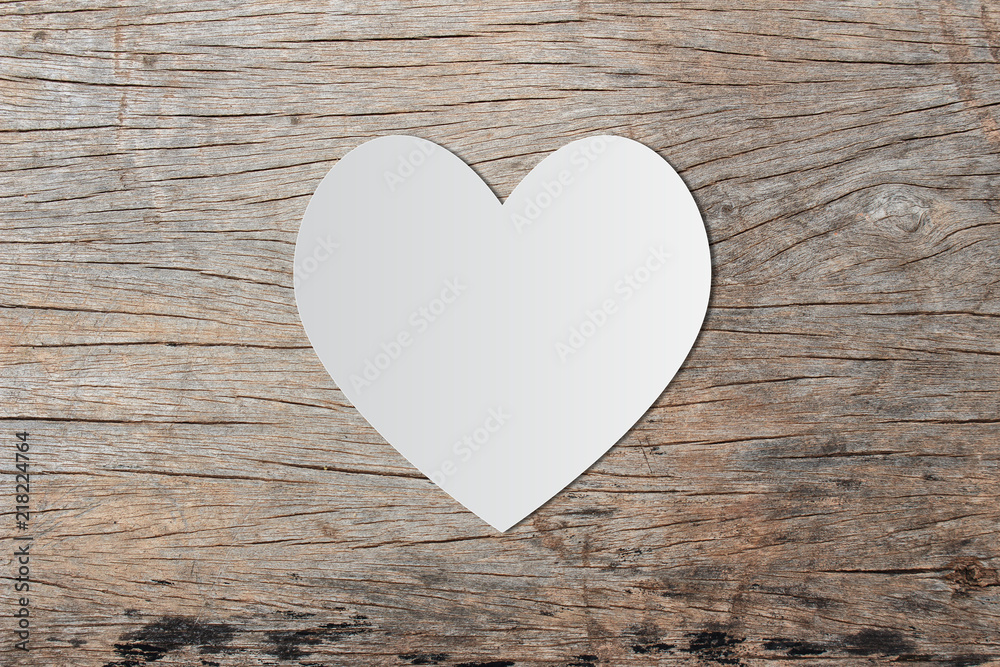 White heart paper on old wooden for valentine's day message White heart paper on old wooden for valentine's day message