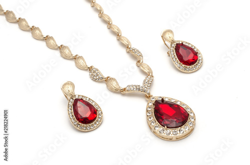 gold necklace and earrings with rubies isolated on white