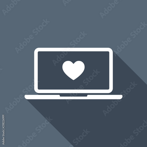 Laptop or notebook computer with heart on screen. Simple icon. W