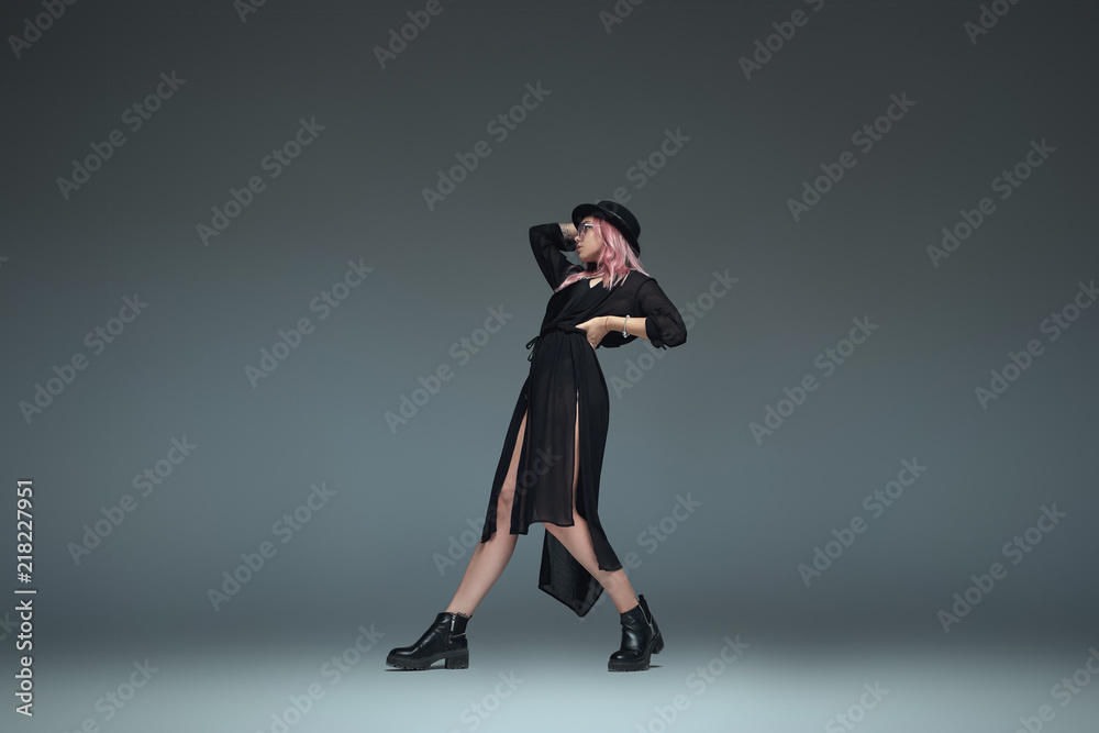 Two fashionable girls wearing black trendy outfits posing