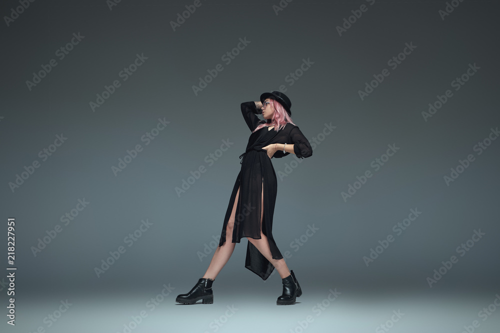 Obraz premium Two fashionable girls wearing black trendy outfits posing
