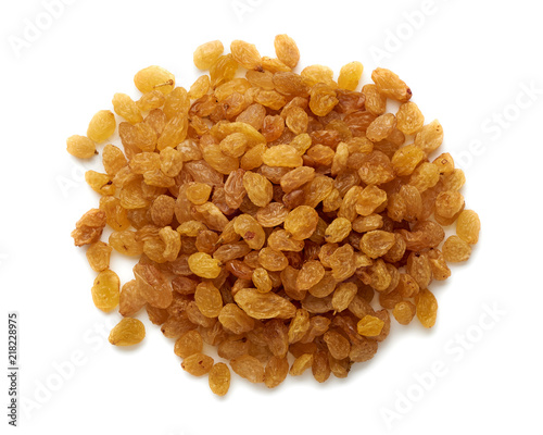Heap of yellow raisins isolated on white background. Top view.