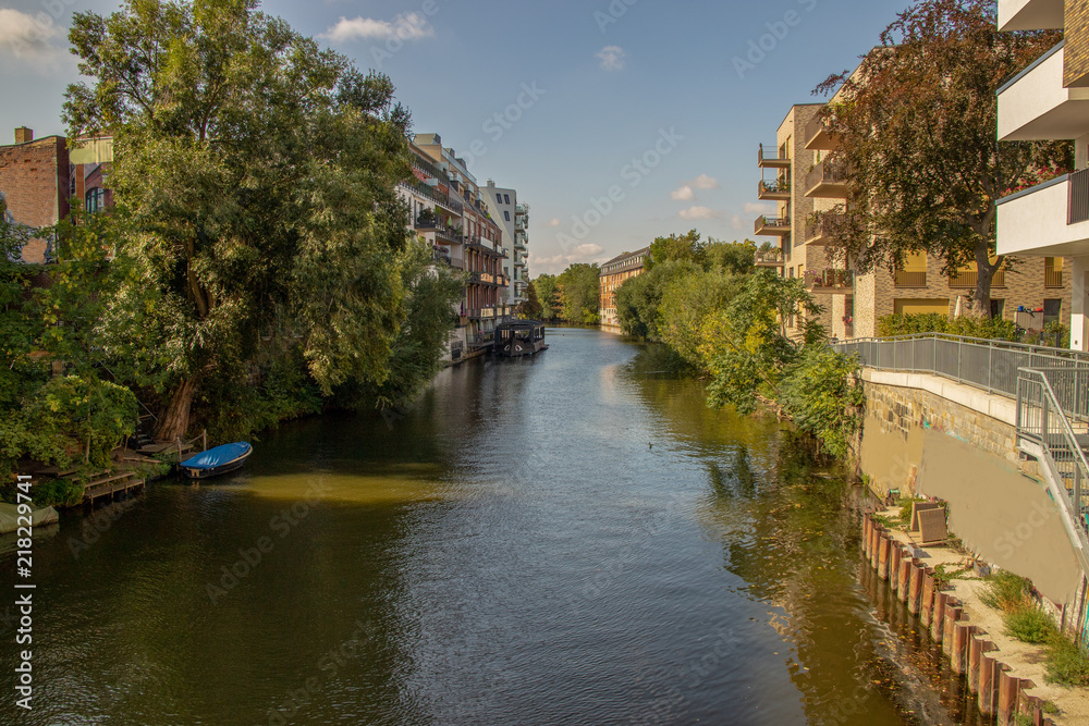 Picture from the river elster in leipzig .It is a popular place of residens in modern architectur in old and new buildings  .This is a beautiful place for watersports.