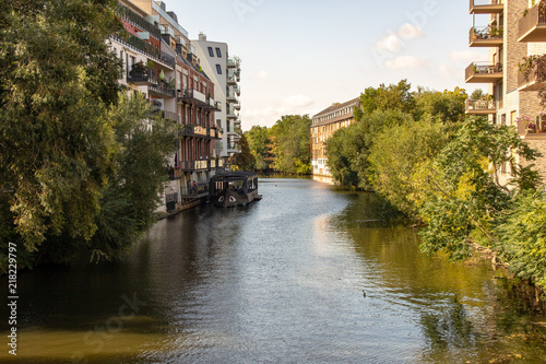 Picture from the river elster in leipzig .It is a popular place of residens in modern architectur in old and new buildings  .This is a beautiful place for watersports. photo