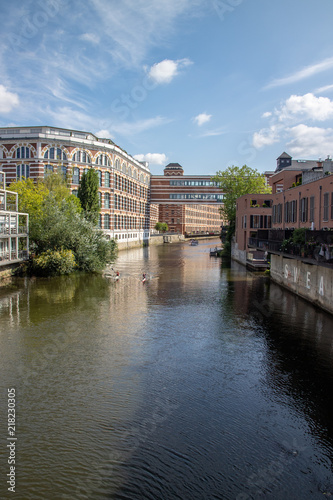 Picture from the river elster in leipzig .It is a popular place of residens in modern architectur in old buildings with name  buntgarnwerke .This is a beautiful place for watersports. photo