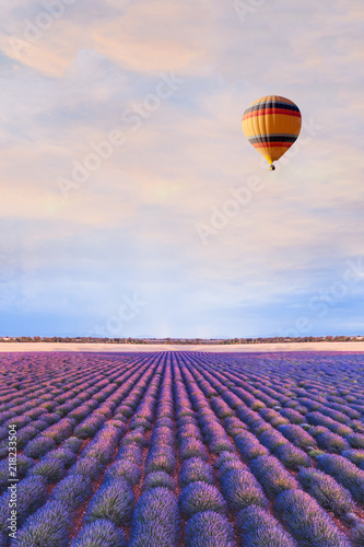 Fototapeta Naklejka Na Ścianę i Meble -  travel destination, beautiful dream inspirational landscape with hot air balloon flying above lavender fields in Provence, tourism in France