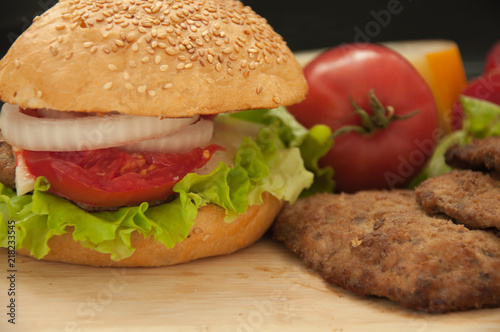 Homemade hamburger with fresh vegetables.
