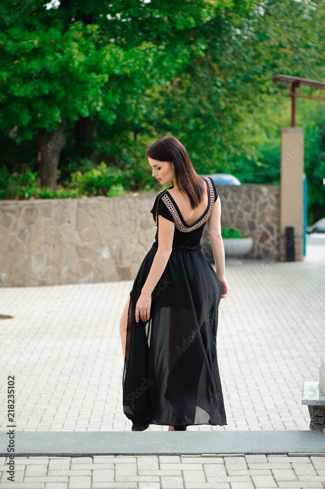 Naklejka premium A woman walking down stairs
