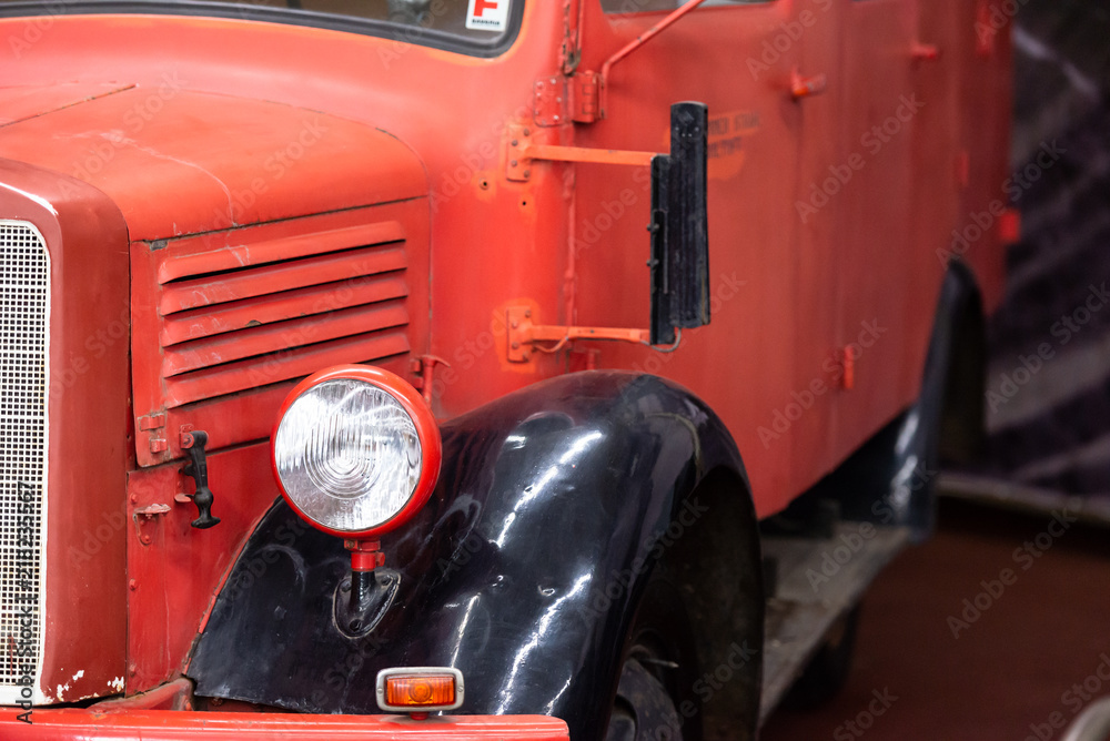 Fototapeta premium Old red truck. Headlight on an old military vehicle.