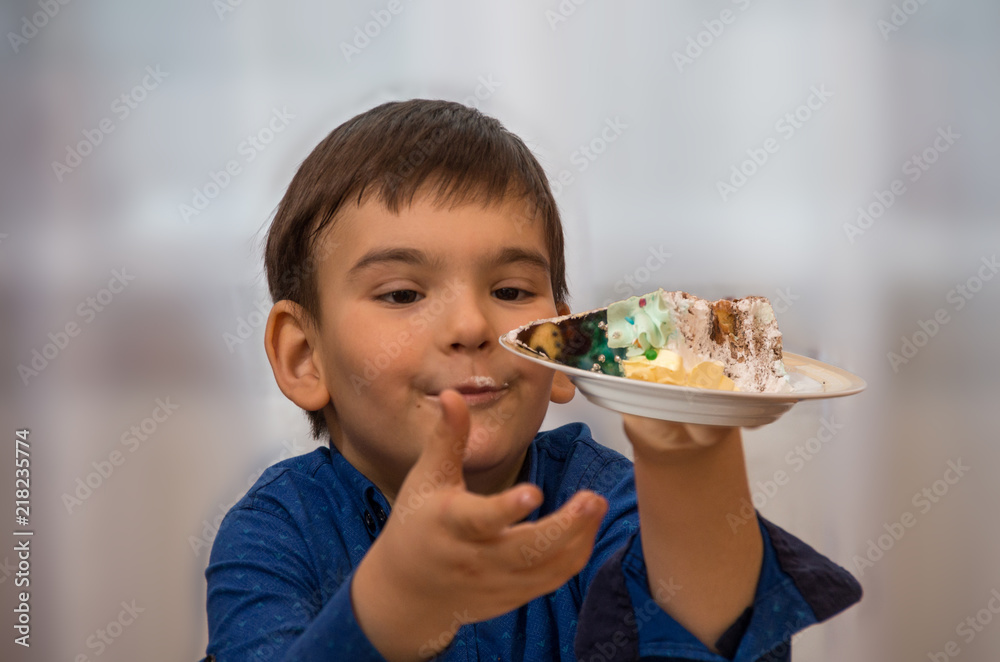 Child boy and cake. Abstract light background. Child boy and cake. Abstract light background.