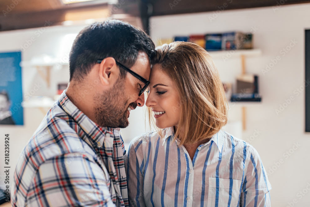 Fototapeta premium Close-up image of beautiful romantic couple touching their foreheads.