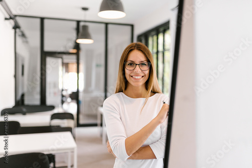 Fototapeta Naklejka Na Ścianę i Meble -  Portrait of smiling female entrepreneur.