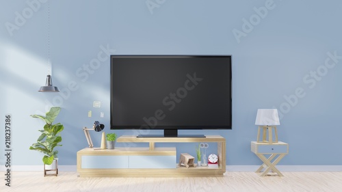 Tv screen in modern empty room and lamp,plants,Decoration on back blue wall background, 3d rendering.