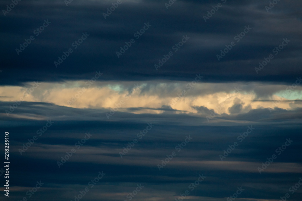 Obraz premium A Sliver of Light in a Dark Stormy Sky
