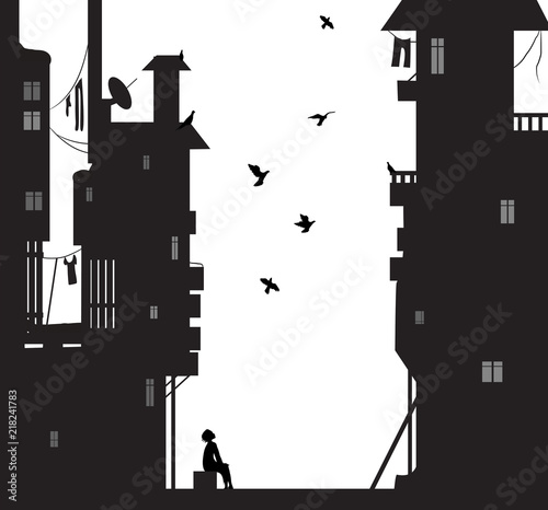 night dreamer, boy sits near the city houses and look flying pigeons, dreams photo