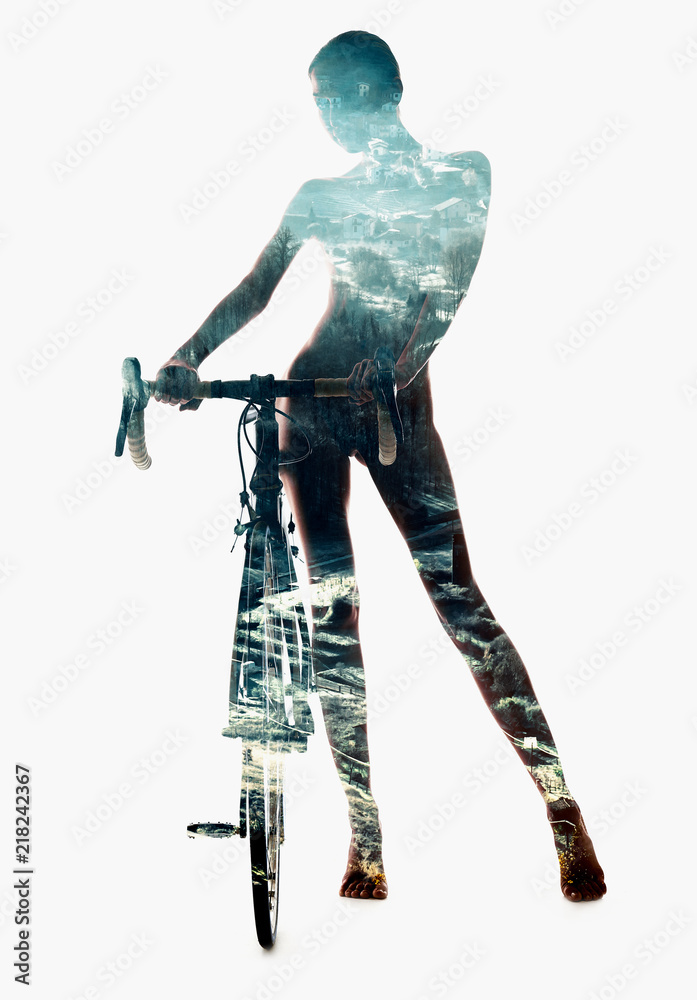 Silhouette of a woman with bicycle combined with a snow-covered countryside landscape. Double exposure, isolated on a white background Silhouette of a woman with bicycle combined with a snow-covered countryside landscape. Double exposure, isolated on a white background