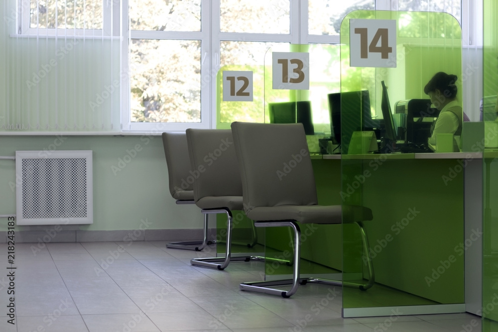 Cozy office green. Chairs for visitors, and empty seats.