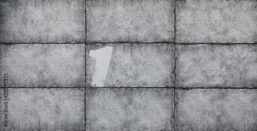 Old conctete blocks wall texture background,gray abstract cement wall with numbers