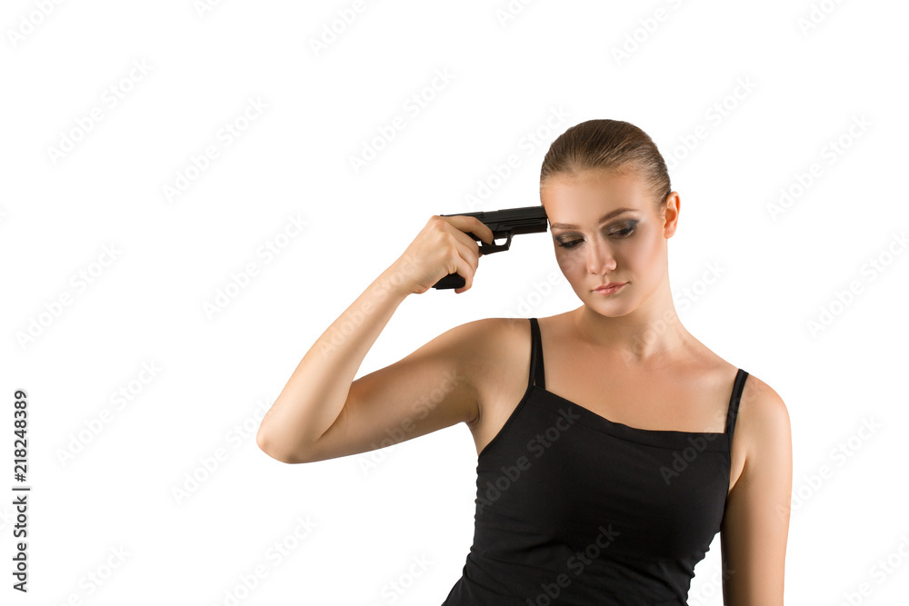 Young beautiful woman holding a gun on white background Young beautiful woman holding a gun on white background