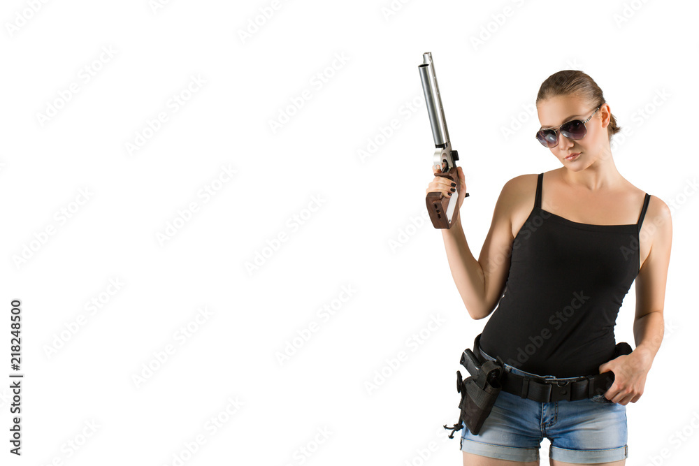 Young beautiful woman holding a gun on white background Young beautiful woman holding a gun on white background