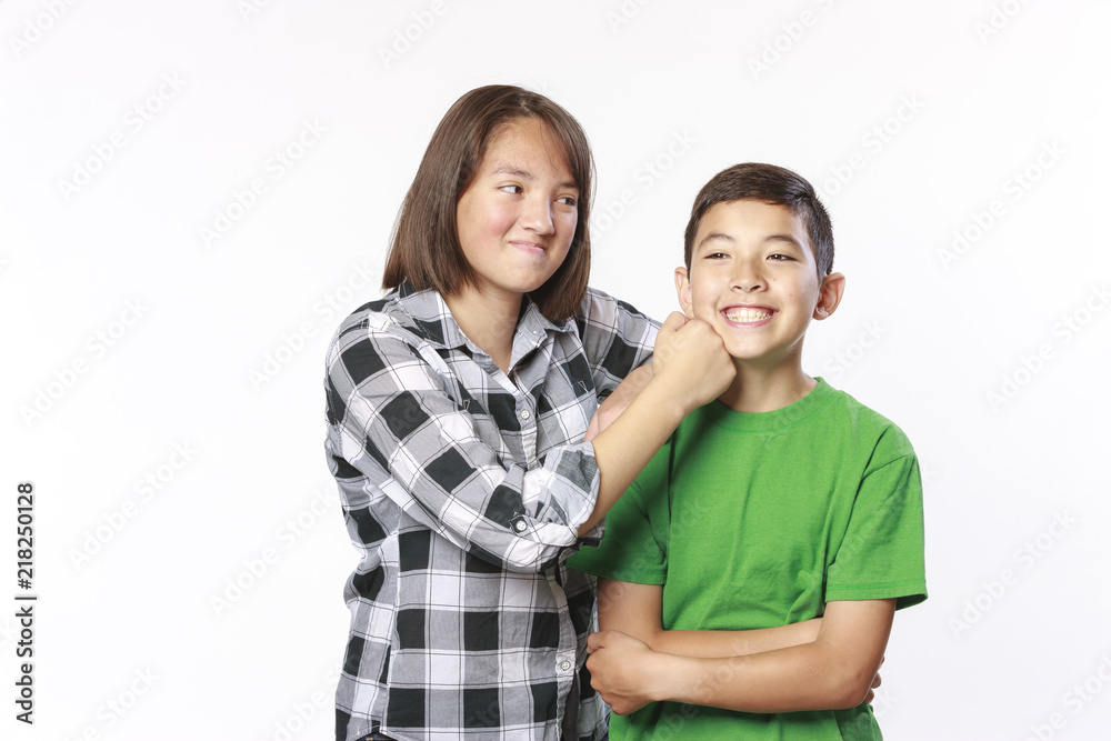 Brother and sister horsing around. Brother and sister horsing around.