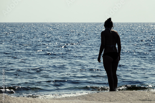 Silhouette of woman standin...