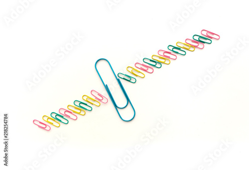 Paper clips on a white background metaphora for fertilization fertility photo