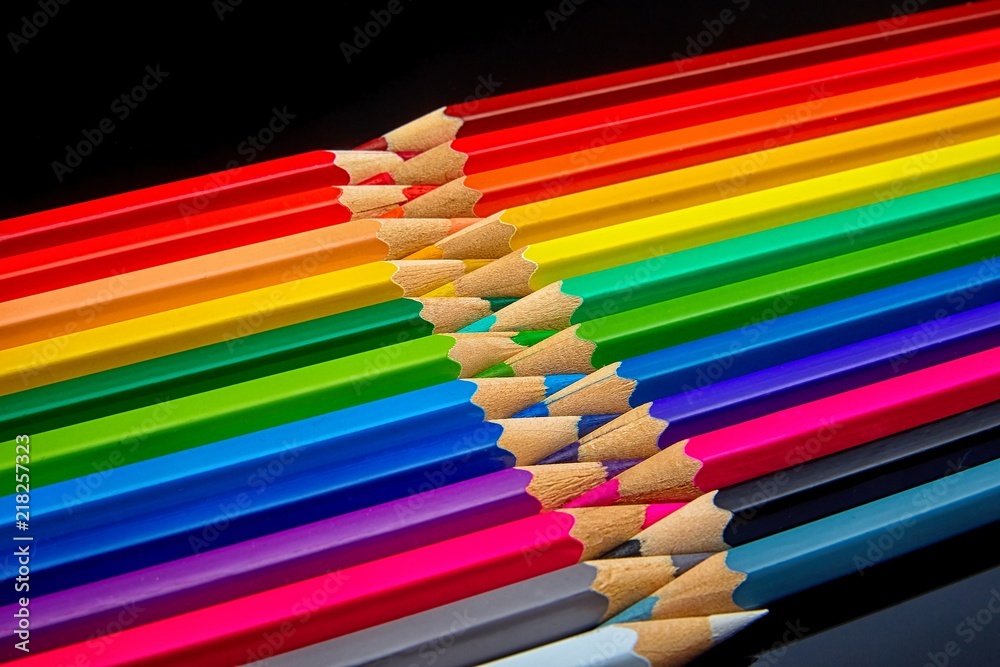 concept-colored pencils laid out on a dark background concept-colored pencils laid out on a dark background