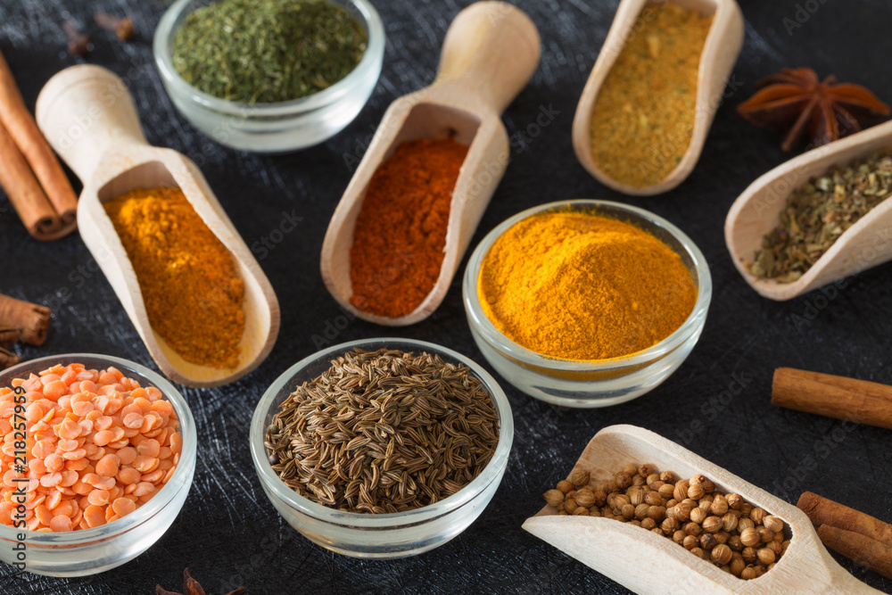 Spices, herbs and food additives on a dark background
