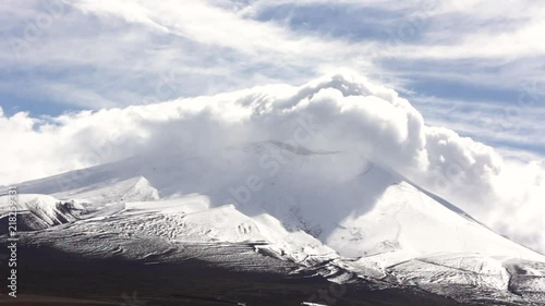 Huge clouds covering the lonquimay volcano photo