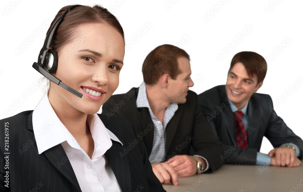 Businesswoman with Headset and Talking Collaborators in Businesswoman with Headset and Talking Collaborators in