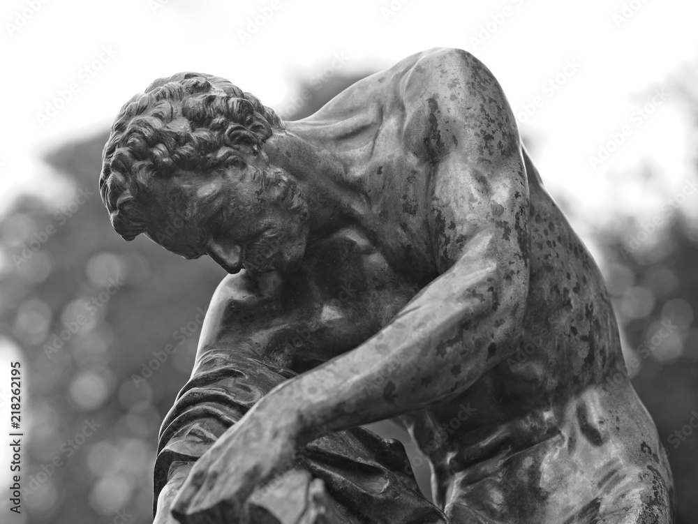 Close-up of figurative bronze sculpture (black and white). Close-up of figurative bronze sculpture (black and white).