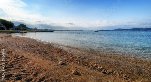 Beach in Turanj, small village in Dalmatia, Croatia, island of Pasman in background photo