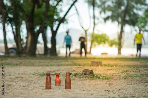 brown woodball gate or finish line on sand ground floor. famous sport for thai elder