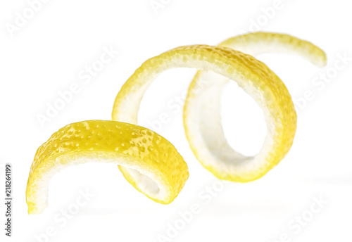Lemon peel on a white background, close-up. Lemon twist.