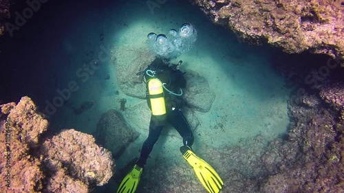 Scubadiving Tenereife. My dive buddy investigate the divesite. photo