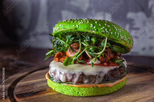 green burger with meat, cheese and mushrooms