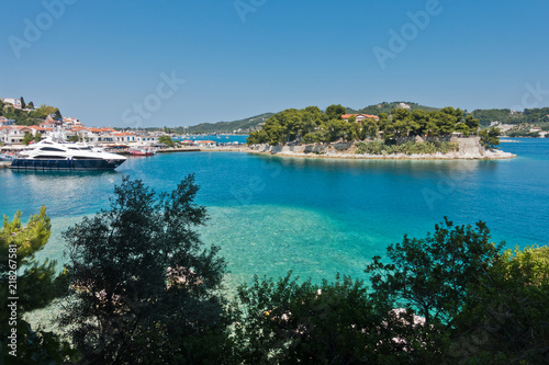 View on a small island in front of Skiathos town waterfront and harbor, Skiathos island, Greece