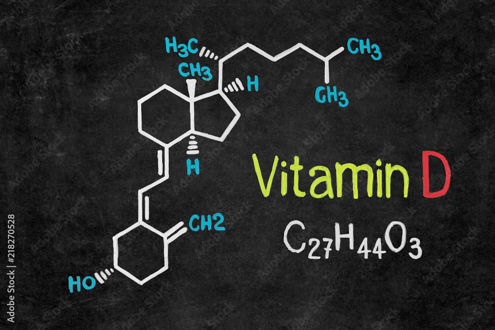 Handwritten chalk chemical formula of Vitamin D on school blackboard