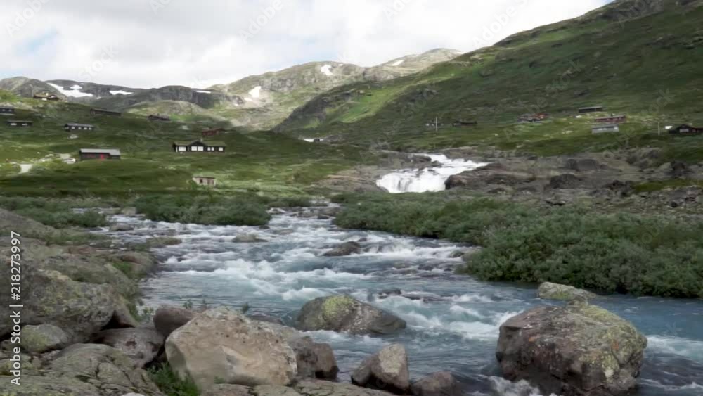 Cabins in the mountains of Norway near a stream. Cabins in the mountains of Norway near a stream.